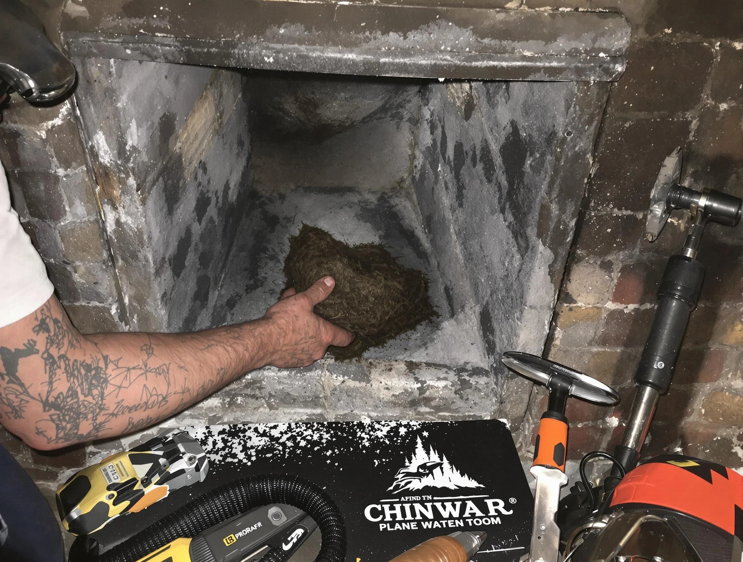 Providence Chimney Sweep safely removing debris and screening chimney in Providence, RI